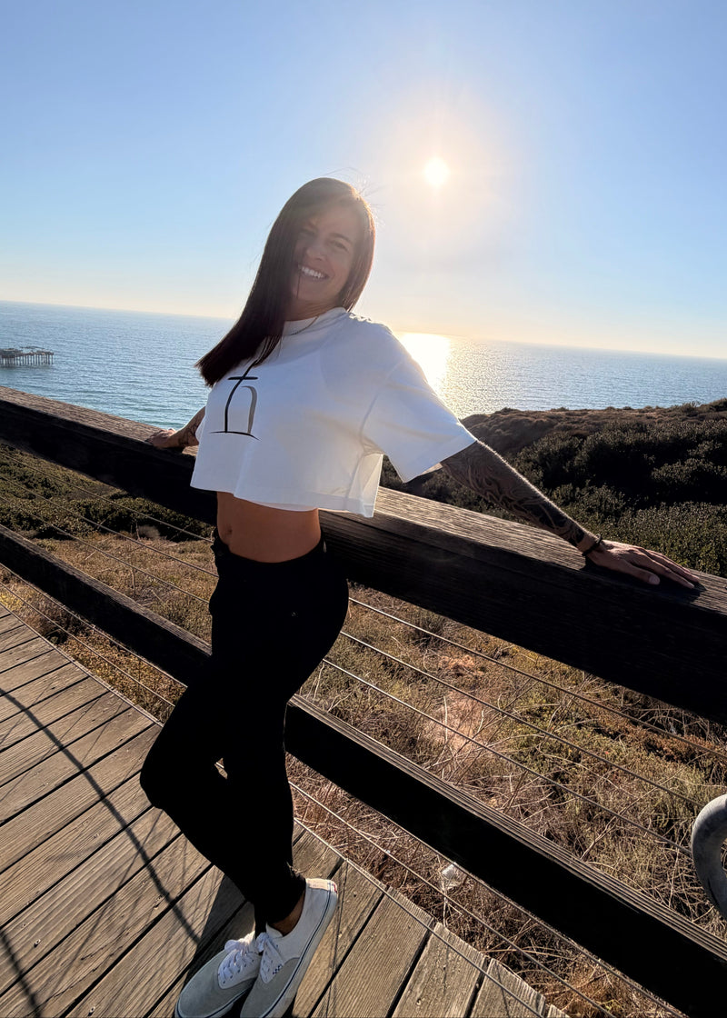 Woman wearing white Ephphatha Christian crop top inspired by Mark 7:34